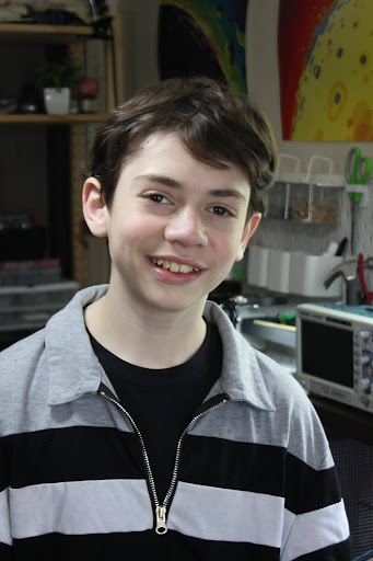 Max in front of his home electronics lab!